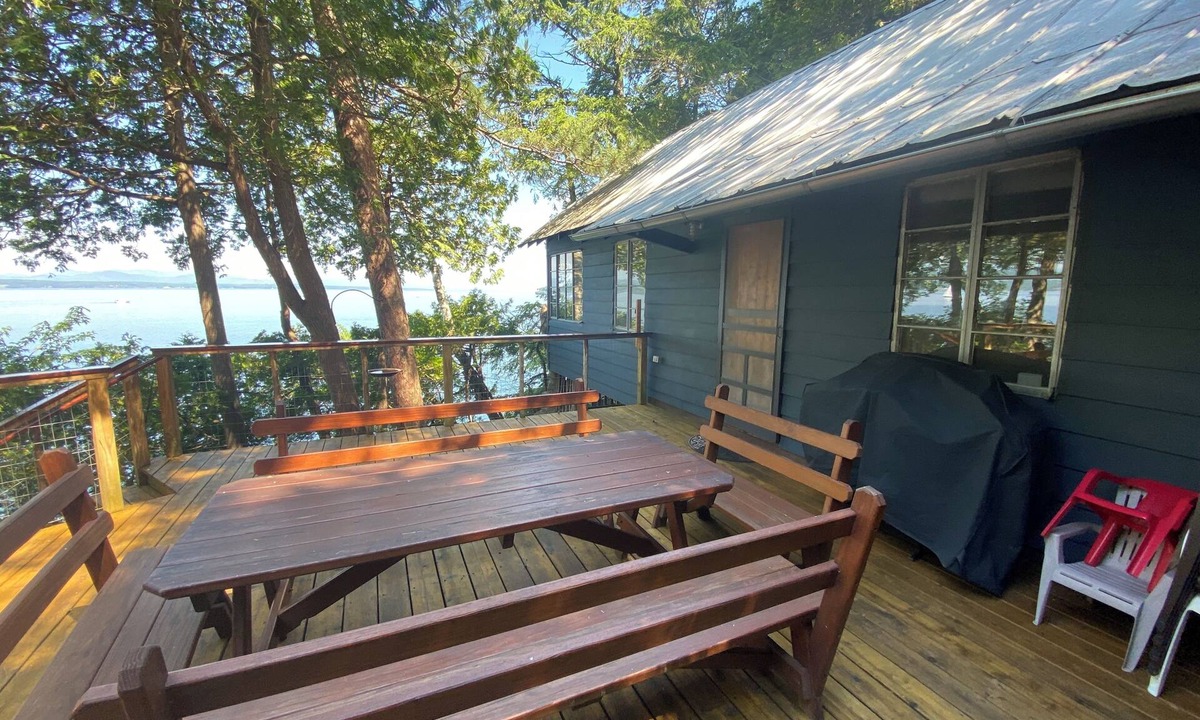 Charlotte Cabin | Lake Champlain camp, spacious deck, sunset & mountain views, beach and dock