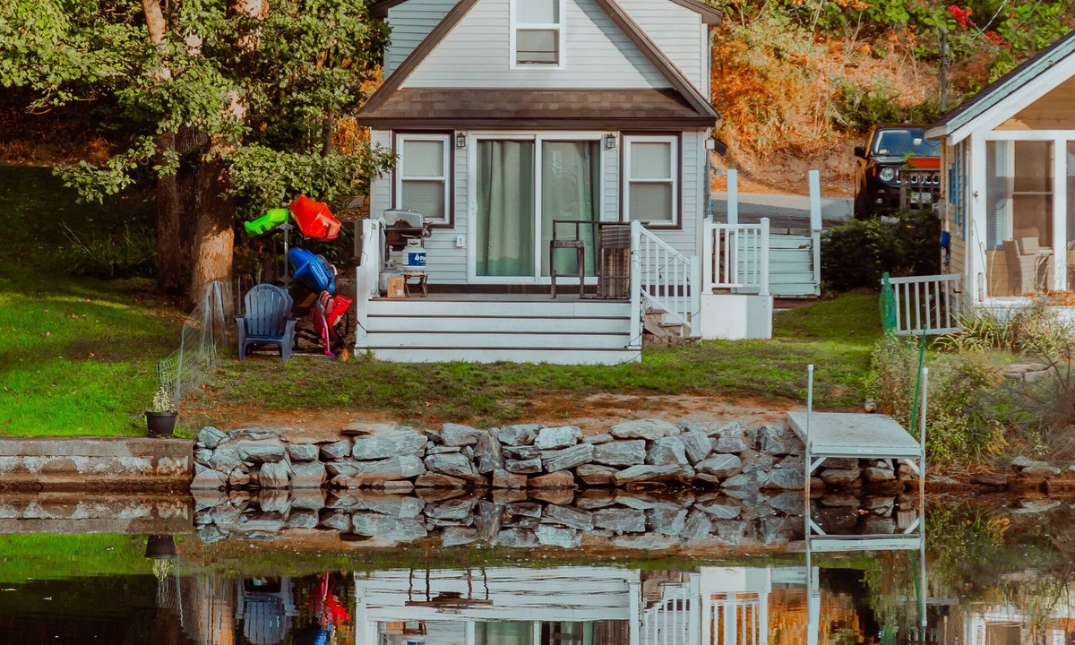 Westminster Cottage | Lakefront; view of ski mountain, firepit, dock, kayaks, paddle board