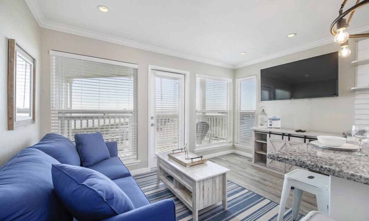 Galveston Condo | Trendy Beach Condo- Sunset views, Sandy Toes, Surfing more. (1304)