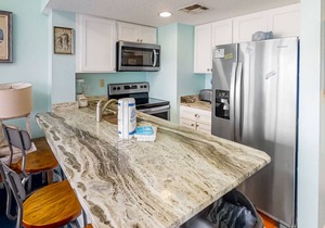Colorful, lofty condo with balcony, beach access, pools, hot tubs & tennis