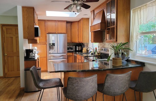 Hampton Bays House | Charming Split-Level House with heated pool, hot tub & a brand-new septic system