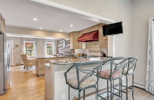 Greenport West House | Colonial-Style Home on 0.48 Acres, Spacious Living and Entertaining Areas,...