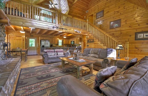 Ellijay Cabin | Hunter's Lodge, a pet-friendly riverfront cabin, complete with a pool table, lit basketball court, fire pit, dock, and WiFi