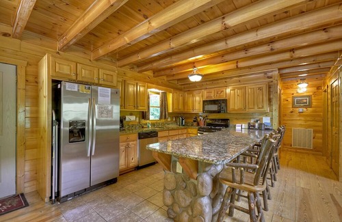Ellijay Cabin | Hunter's Lodge, a pet-friendly riverfront cabin, complete with a pool table, lit basketball court, fire pit, dock, and WiFi