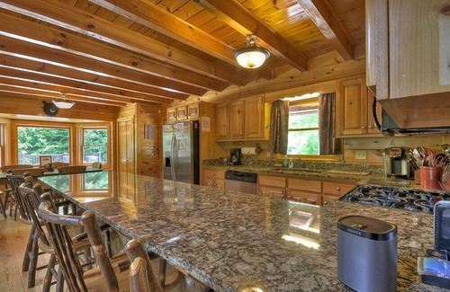 Ellijay Cabin | Hunter's Lodge, a pet-friendly riverfront cabin, complete with a pool table, lit basketball court, fire pit, dock, and WiFi