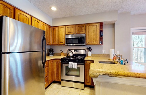 Ludlow Condo | Ski-in/out condo near lifts with a fireplace, pool, hot tub, & tennis