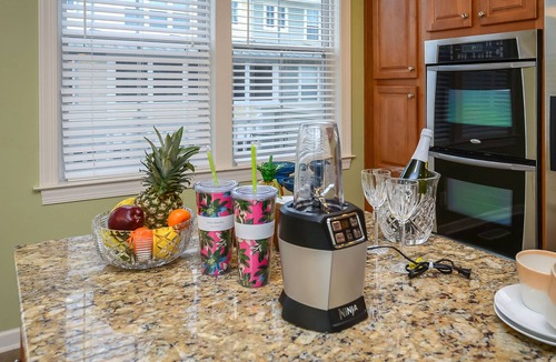 Sunset Island House | Bright, fun 5-bedroom townhouse in exclusive gated community with free WiFi, an indoor/outdoor pool, private bayside beaches, a restaurant, and more!