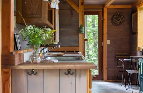 Johnson House | Caboose Tiny Home on river with hot tub near Stowe