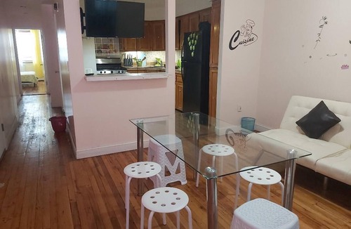 Queens House | Charming 4-bedroom, 2 bath, balcony townhome in Queens