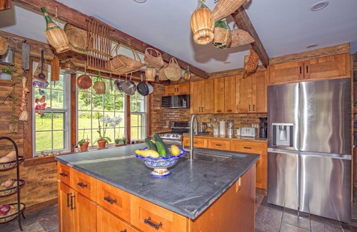 Williamstown House | Charming barn ski house with exposed rustic beams and cathedral ceilings.