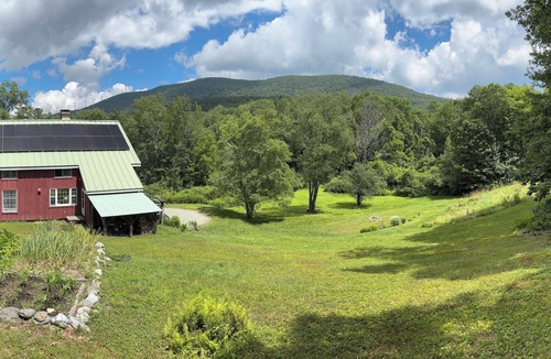 Williamstown House | Charming barn ski house with exposed rustic beams and cathedral ceilings.