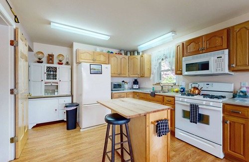 Norway House | Charming lakefront home with water views, dock & inviting deck, Central A/C