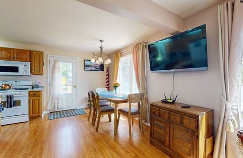 Norway House | Charming lakefront home with water views, dock & inviting deck, Central A/C