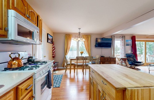 Norway House | Charming lakefront home with water views, dock & inviting deck, Central A/C