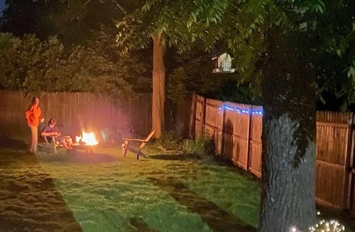 Riverhead House | Charming Riverhead home with large outdoor patio & backyard firepit