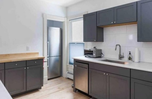 Old North End Apartment | Cityscape Sanctuary: parking+laundry