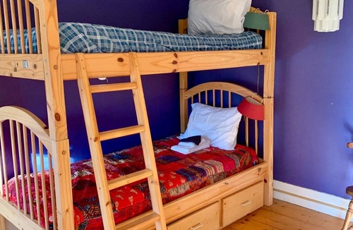 Rowe Bed & Breakfast | Colorful Bunk Bed Room, Cozy Farmhouse Retreat - Purple Dorm