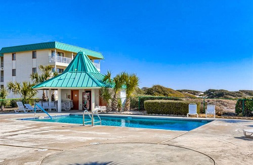 Fort Morgan Condo | Colorful, lofty condo with balcony, beach access, pools, hot tubs & tennis