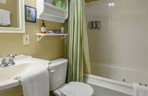 Stowe Bed & Breakfast | Comfortable, pet friendly room with queen bed, a stunning view of Mount Mansfield, sitting area and a fireplace with full service breakfast included