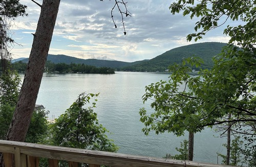 Ticonderoga House | Cozy 2 bedroom cabin at Lake George water's edge with deck & beautiful sunsets.