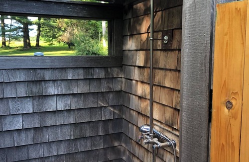 Derby Cabin | Cozy lakeside cabin with AC and WiFi . 240 ft private beach and dock