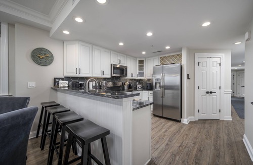 Ocean City Condo | Enjoy a large, spacious designer unit with all the extras plus an indoor pool, outdoor pool, fitness room, assigned parking and shops on the ground level.