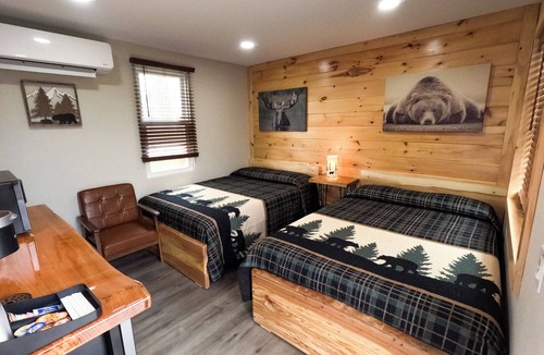 North Greece Hotel | Escape to the tranquility of our cozy cabin inn, where rustic charm meets modern comfort. Experience a home away from home ambiance.