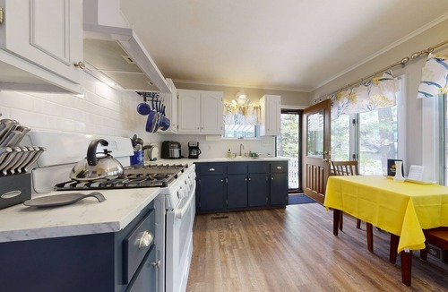 The Bays House | Homey lakeside property w/one house, two cottages, mtn. views, & private beach