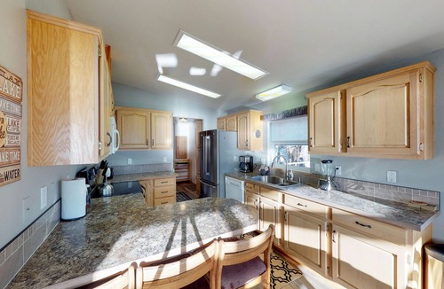 Manson House | Lakeview home with wrap-around deck, easy lake access, private hot tub, & more
