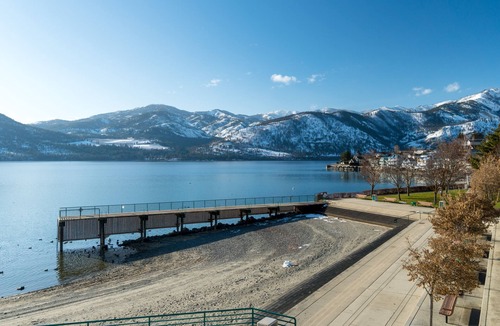 Manson House | Lakeview home with wrap-around deck, easy lake access, private hot tub, & more