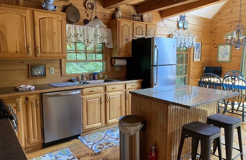 Kents Hill House | Light-Filled Log Home, 4 Wooded Acres, & Lake Access. The water is 0.4 mi away.
