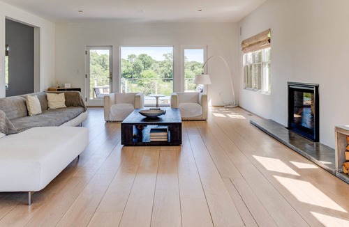 Eastport House | Modern-style home with a private pool, vast back lawn, several sitting...