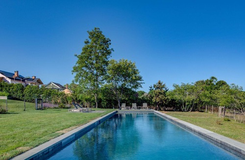 Eastport House | Modern-style home with a private pool, vast back lawn, several sitting...
