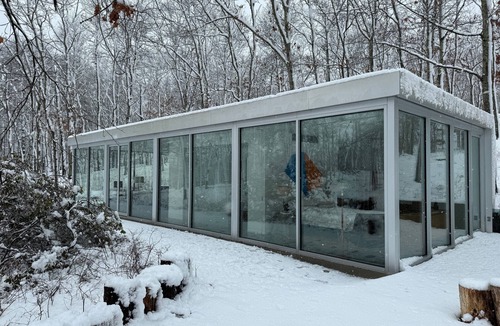 Water Mill House | Modernist Glass House nestled in tall pines and nature offering total privacy