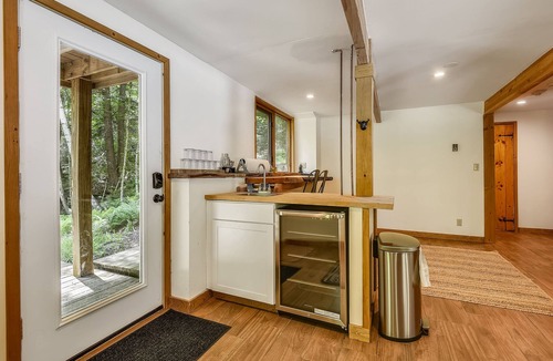 West Bridgewater Ski Chalet | Northeast Passage Chalet is a cozy and warm. Wonderful hot tub on the deck and a great big stone fireplace.