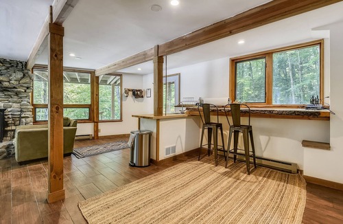 West Bridgewater Ski Chalet | Northeast Passage Chalet is a cozy and warm. Wonderful hot tub on the deck and a great big stone fireplace.