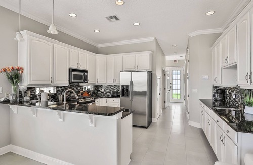 Reunion Villa | Oasis Villa | 5BR, 4.5 Bath Luxe Home w/Private Pool, Arcade, and Theater Near Orlando Theme Parks