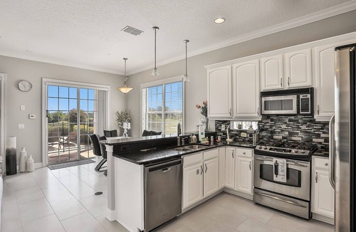 Reunion Villa | Oasis Villa | 5BR, 4.5 Bath Luxe Home w/Private Pool, Arcade, and Theater Near Orlando Theme Parks