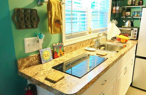 Winchester House | Peaceful Secret Gardens Tiny Home - loft & stairs lead to a Queen Size Bed