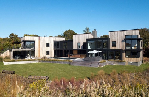 North Sea House | Pristine 6-bedroom waterfront property with a private dock in Southampton