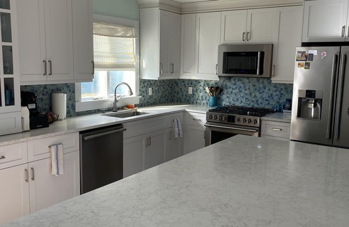 Silver Beach House | Private heated pool and spacious yard. 5 minute walk to the beach.