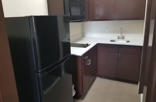 Bay City Hotel | Queen Bedroom with Kitchenette, Perfect for a Comfortable Stay in Bay City
