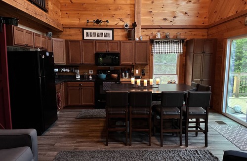 Stark Cabin | Ride right from this trailside cozy cabin in the woods with private pond.
