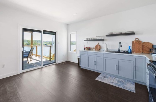 Russell Condo | RiverSuite1 - A mesmerizing river & bridge view.