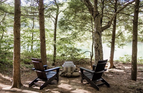 Grafton County RV Rental | Safari Tent Site 5 | 1 King Bed | Pond View