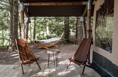 Grafton County RV Rental | Safari Tent Site 5 | 1 King Bed | Pond View