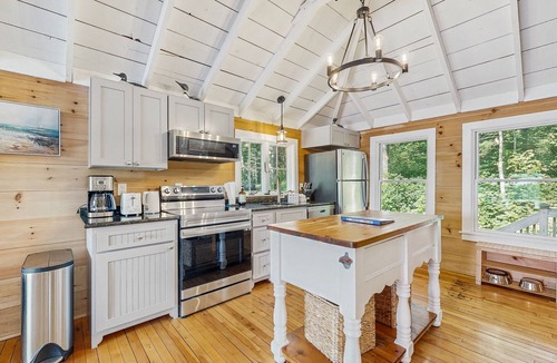 Union House | Spacious lakefront home with stunning views, hot tub, fire pit, dock & swimming