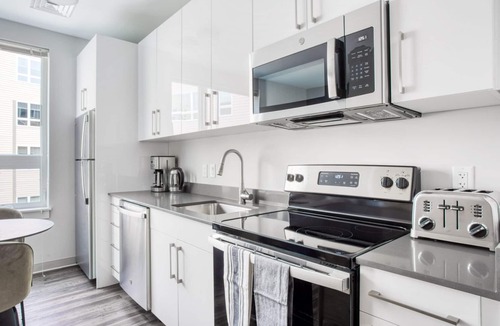 St. Elizabeth's Apartment | Trendy Brighton Studio w/W/D, Gym, near T, Shops + Dining, by Blueground