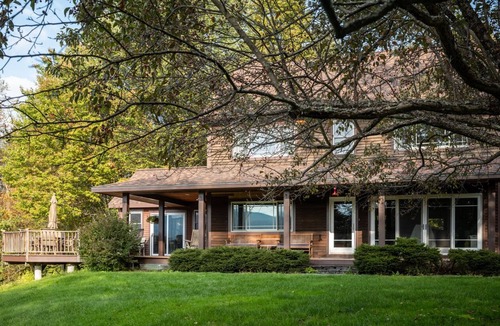 Waterbury House | Private hilltop home close to skiing. Enjoy views, hot tub & fire pit!
