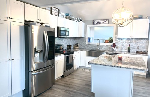 Clayton House | Walkable, modern, spacious village home, dockage, hot tub, fenced in yard.